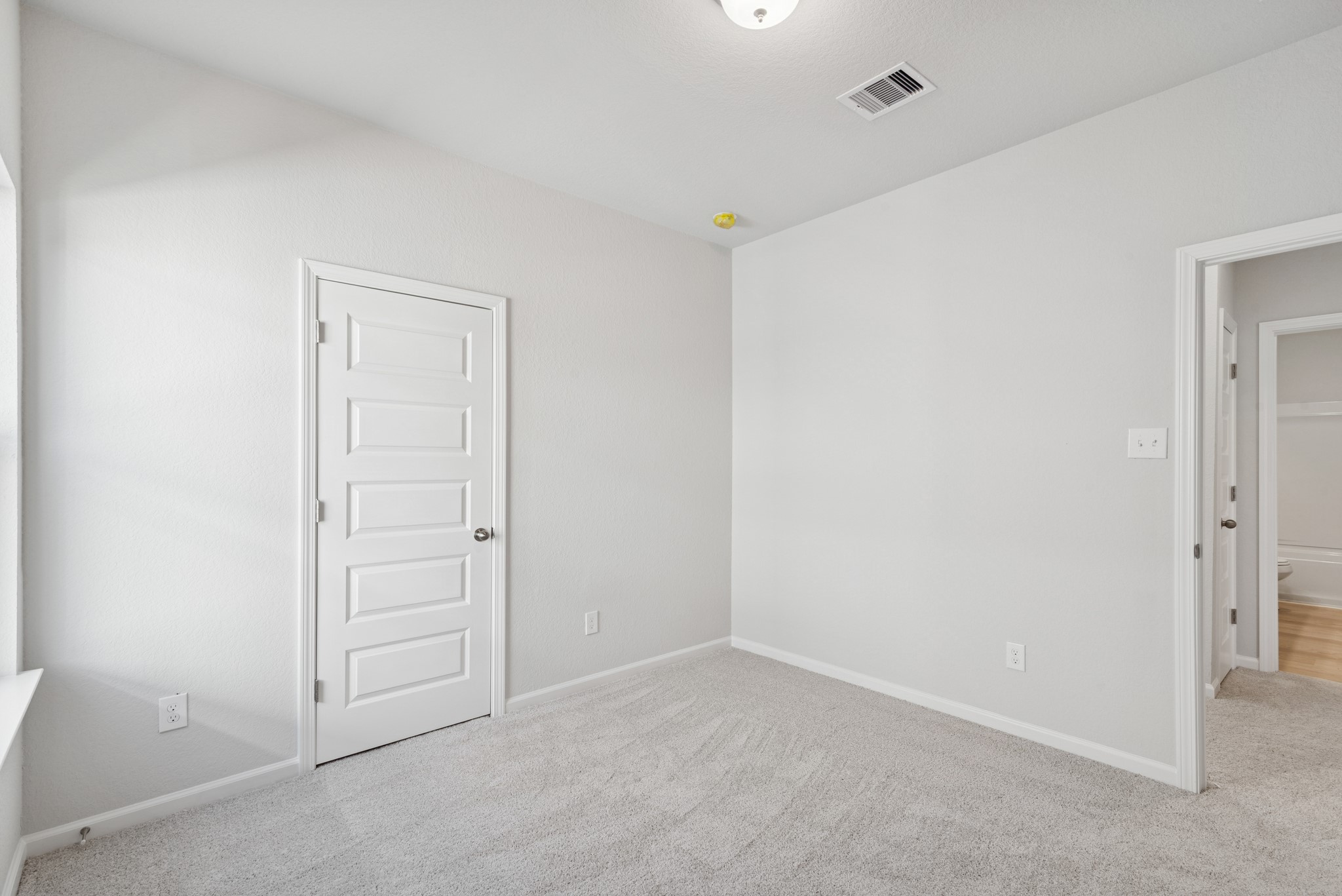 9761 Enclave Ridge Road Willis, TX 77318 - Photo 22 of 28 an empty room with closet area