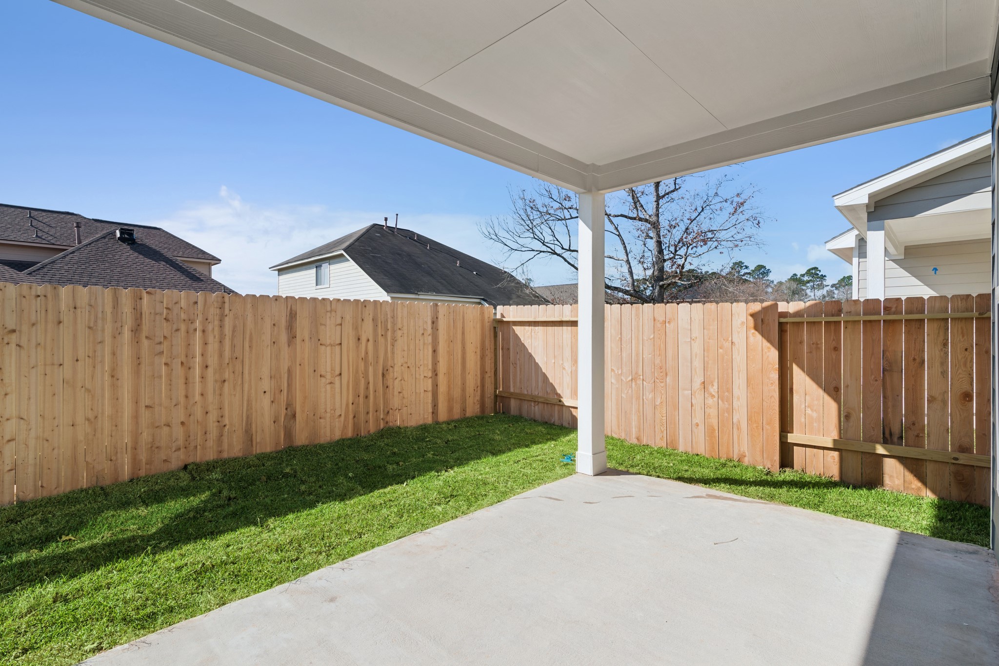 9761 Enclave Ridge Road Willis, TX 77318 - Photo 25 of 28 a view of a backyard with potted plants