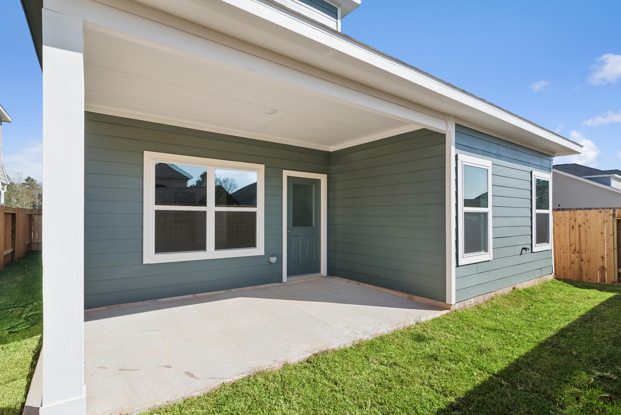 9761 Enclave Ridge Road Willis, TX 77318 - Photo 26 of 28 a front view of a house with a yard