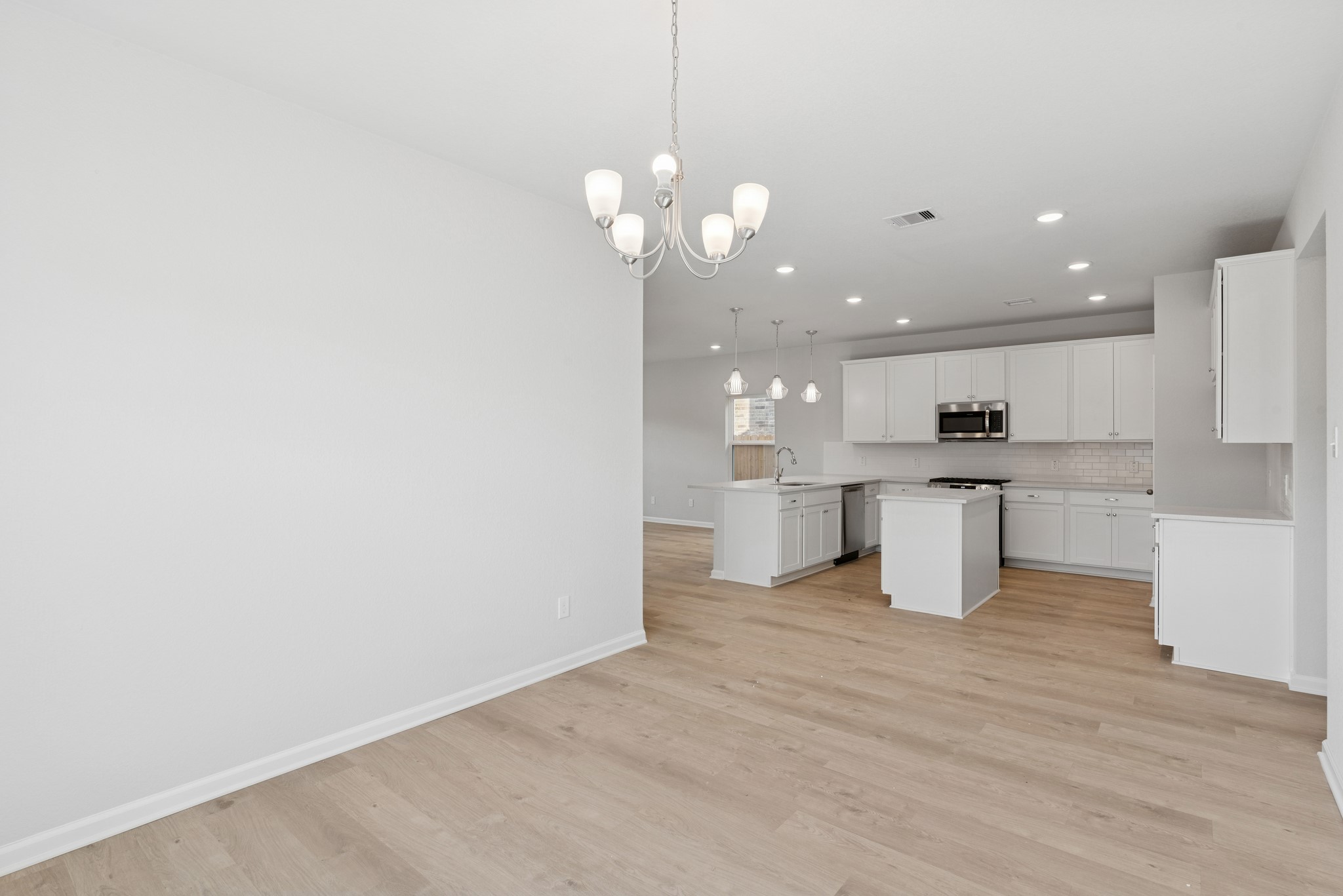 9761 Enclave Ridge Road Willis, TX 77318 - Photo 4 of 28 a view of a kitchen with a sink and dishwasher