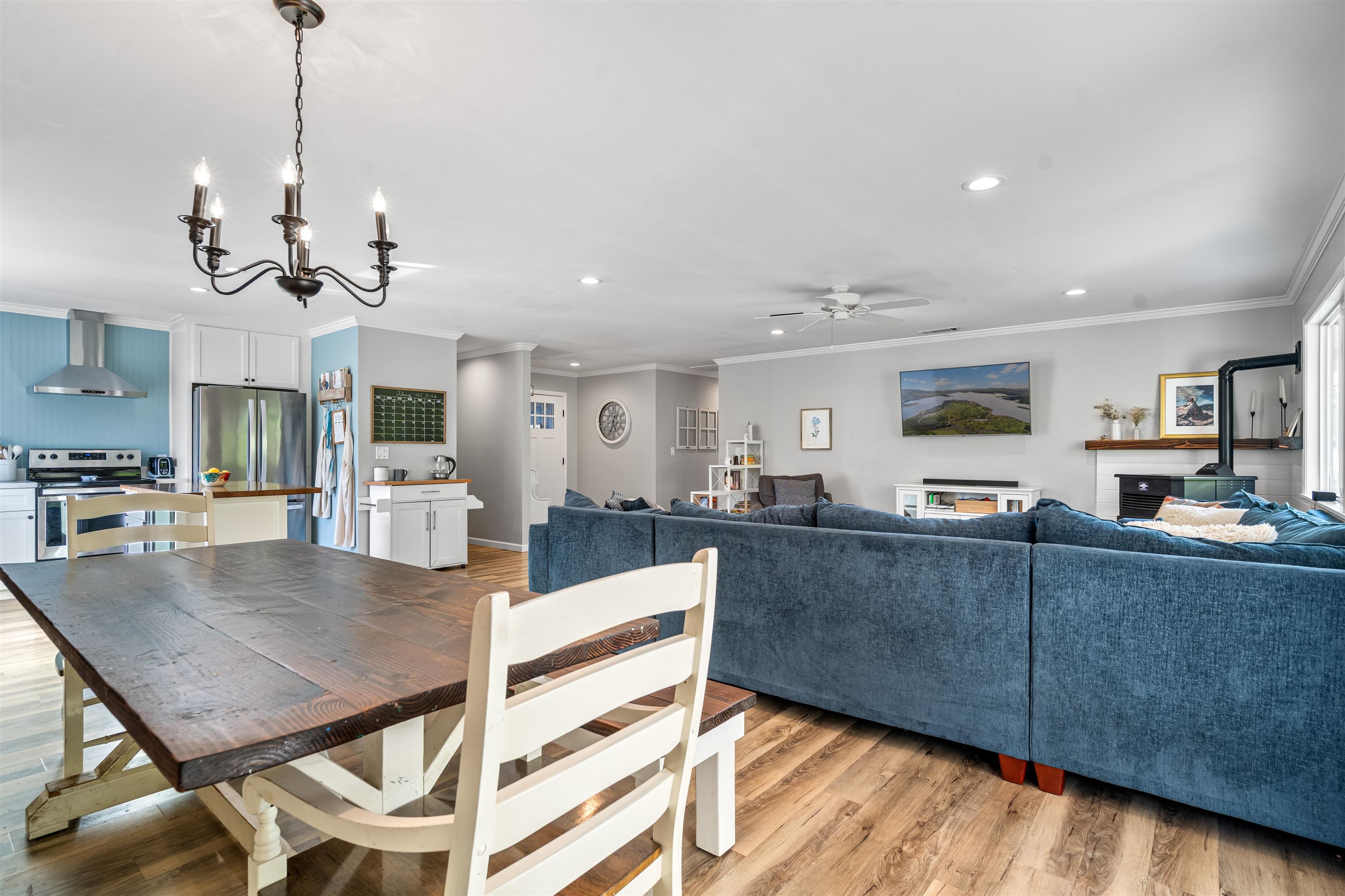 3281 Dunn Road Valley Springs, CA 95252 - Photo 17 of 59 Dining room featuring light wood finished floors, ornamental molding, hanging lights, and a ceiling fan