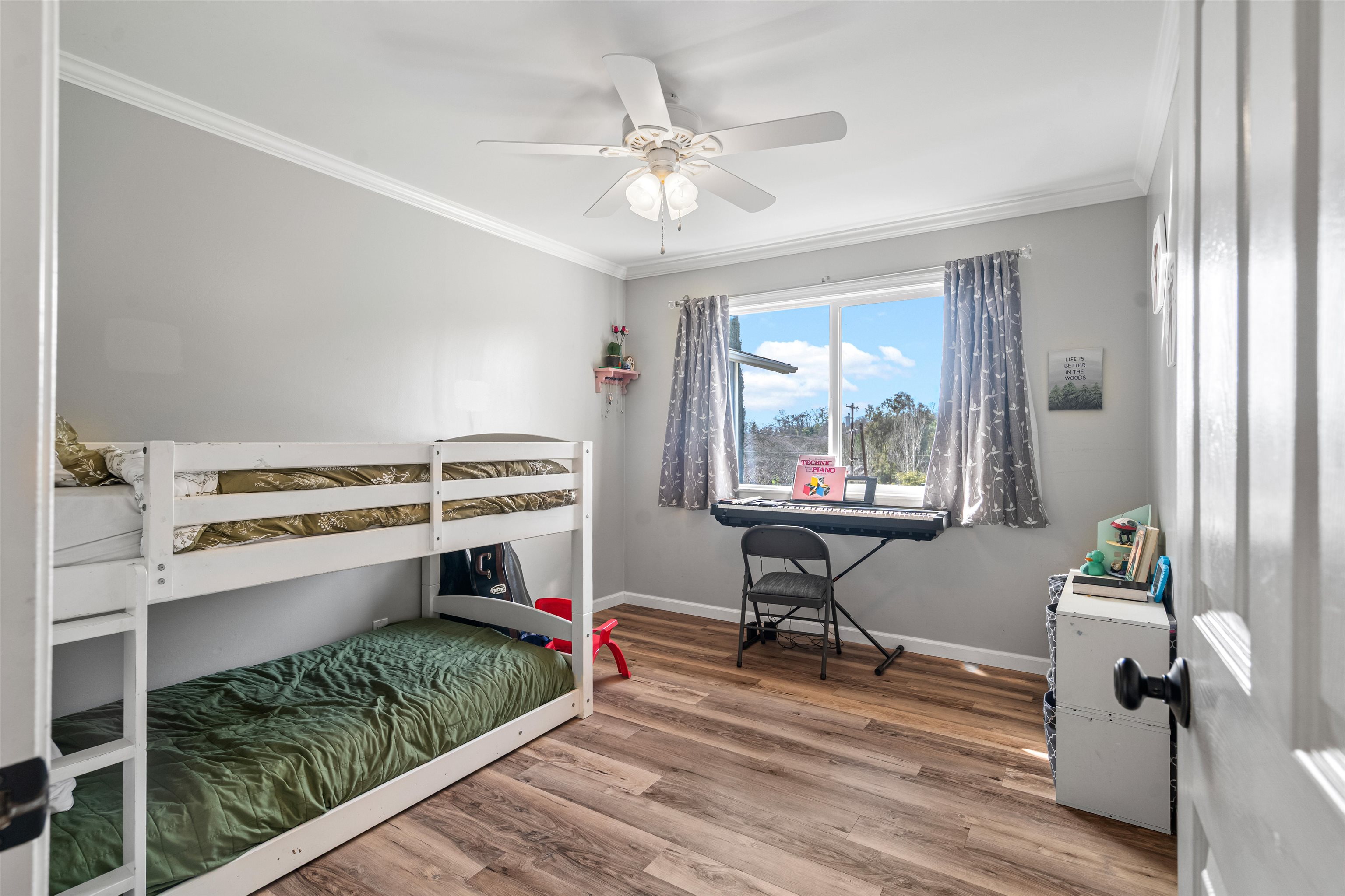 3281 Dunn Road Valley Springs, CA 95252 - Photo 23 of 59 Bedroom with light wood finished floors, ornamental molding, and a ceiling fan