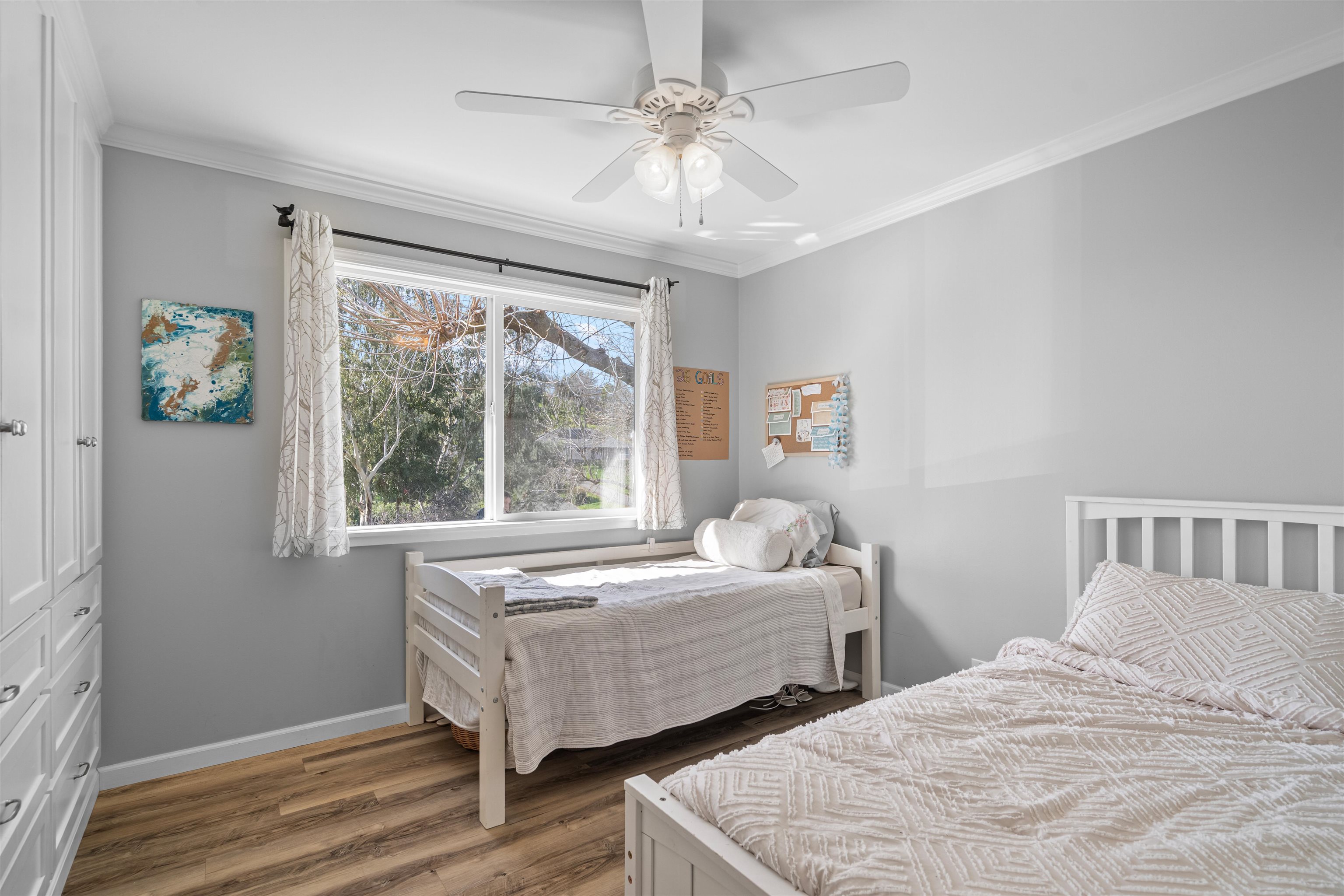 3281 Dunn Road Valley Springs, CA 95252 - Photo 27 of 59 Bedroom featuring crown molding, wood finished floors, ceiling fan, and a closet