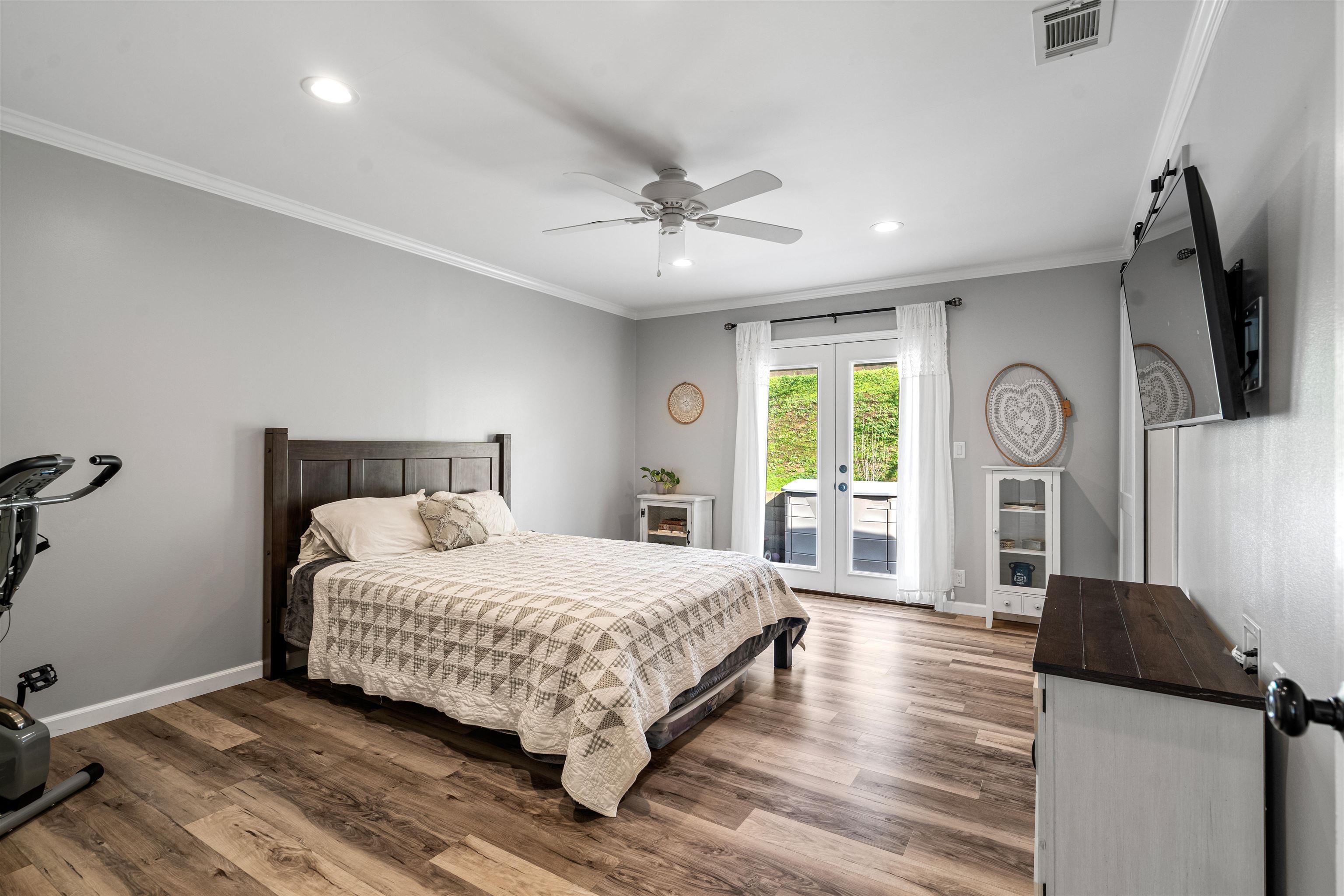 3281 Dunn Road Valley Springs, CA 95252 - Photo 29 of 59 Bedroom with ornamental molding, access to outside, wood finished floors, french doors, and a ceiling fan