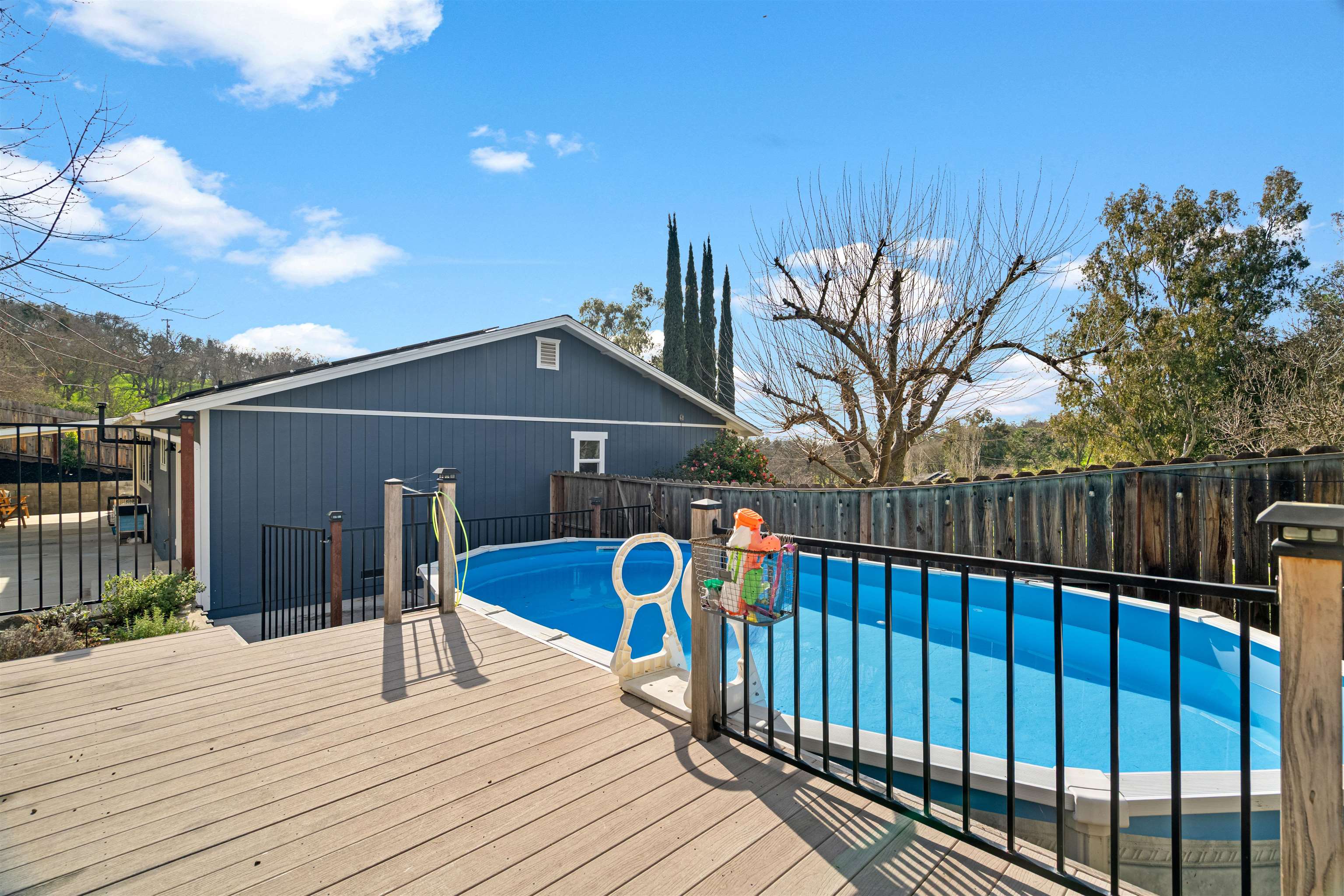 3281 Dunn Road Valley Springs, CA 95252 - Photo 53 of 59 View of swimming pool with a fenced backyard, a deck, and patio surround