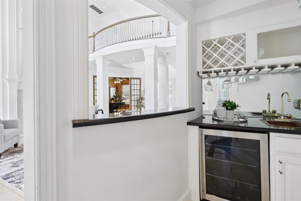 6065 Dilbeck Lane Dallas, TX 75240 - Photo 11 of 40 a bathroom with a sink and a mirror