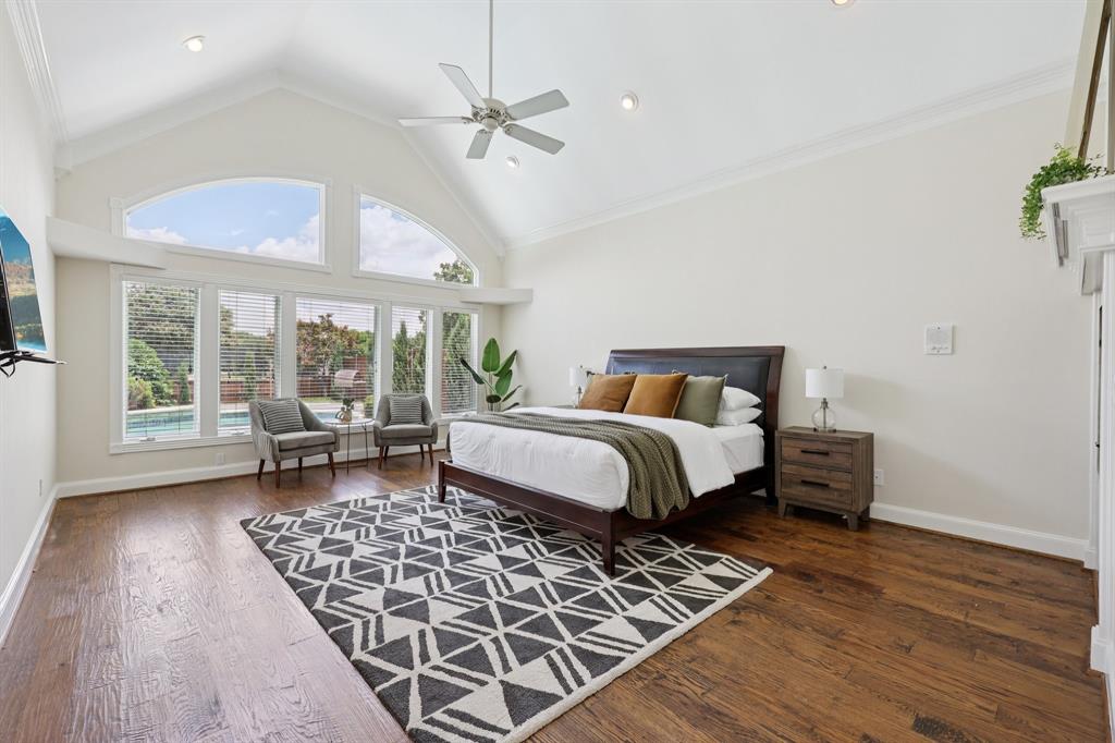6065 Dilbeck Lane Dallas, TX 75240 - Photo 14 of 40 a bedroom with a large bed and a window