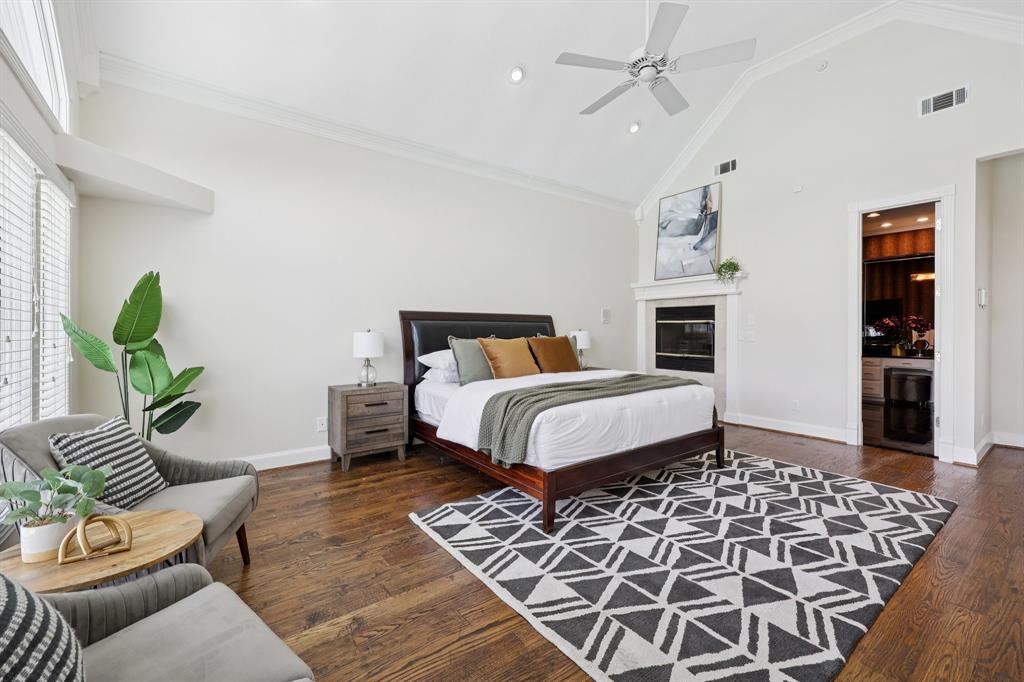 6065 Dilbeck Lane Dallas, TX 75240 - Photo 15 of 40 a bedroom with a large bed and a couch