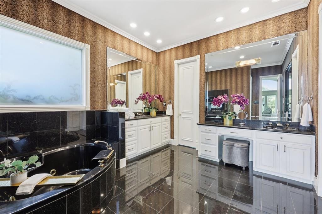 6065 Dilbeck Lane Dallas, TX 75240 - Photo 16 of 40 a kitchen with a sink stove and cabinets