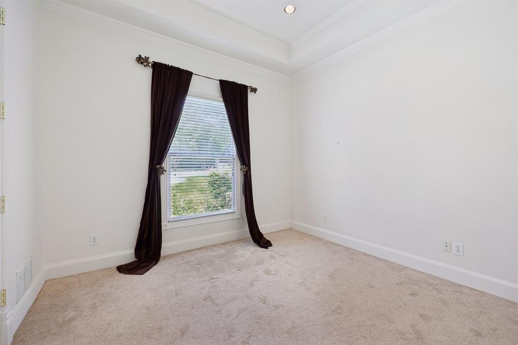 6065 Dilbeck Lane Dallas, TX 75240 - Photo 19 of 40 an empty room with windows