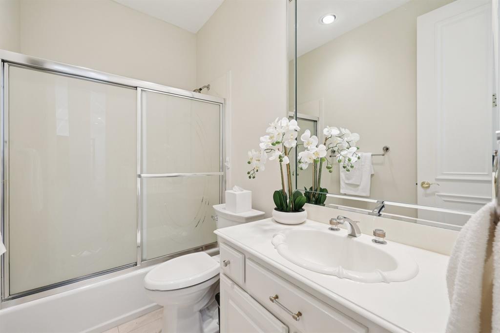 6065 Dilbeck Lane Dallas, TX 75240 - Photo 20 of 40 a bathroom with a sink toilet and shower