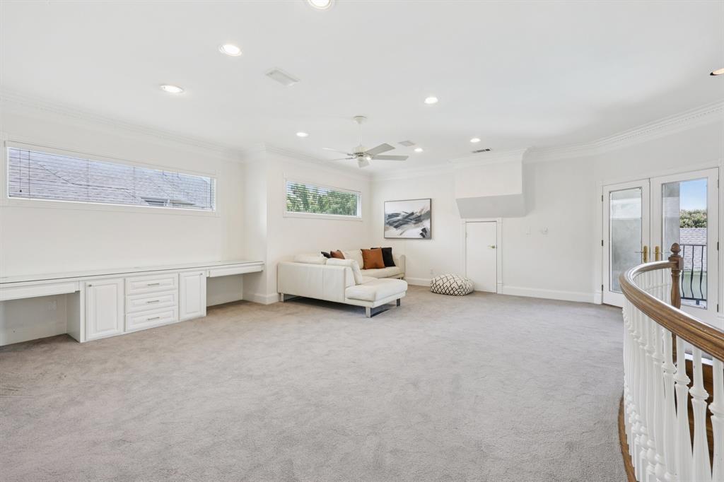 6065 Dilbeck Lane Dallas, TX 75240 - Photo 23 of 40 a view of a livingroom with furniture and a window