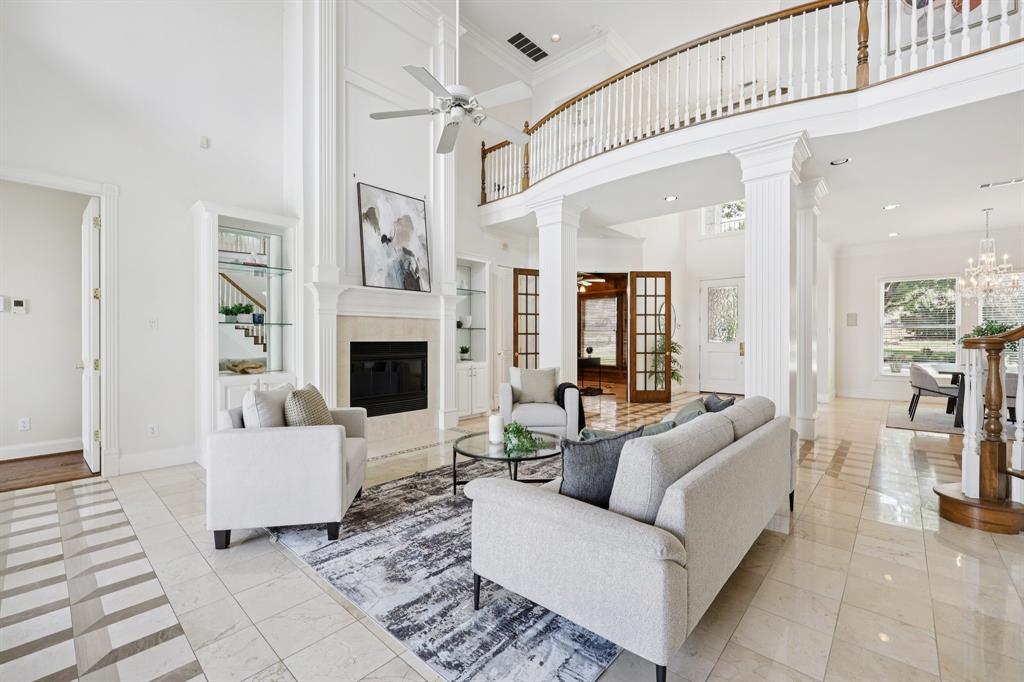 6065 Dilbeck Lane Dallas, TX 75240 - Photo 6 of 40 a living room with furniture and a fireplace