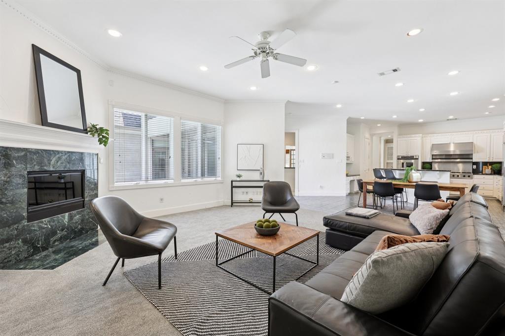 6065 Dilbeck Lane Dallas, TX 75240 - Photo 7 of 40 a living room with furniture and a fireplace