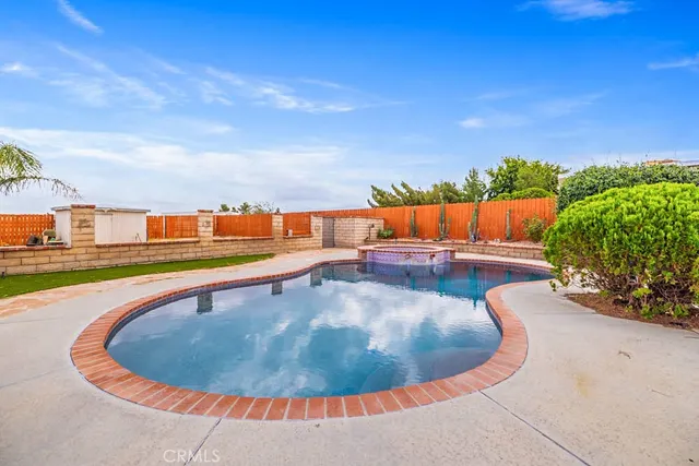a view of a swimming pool with a lounge chair
