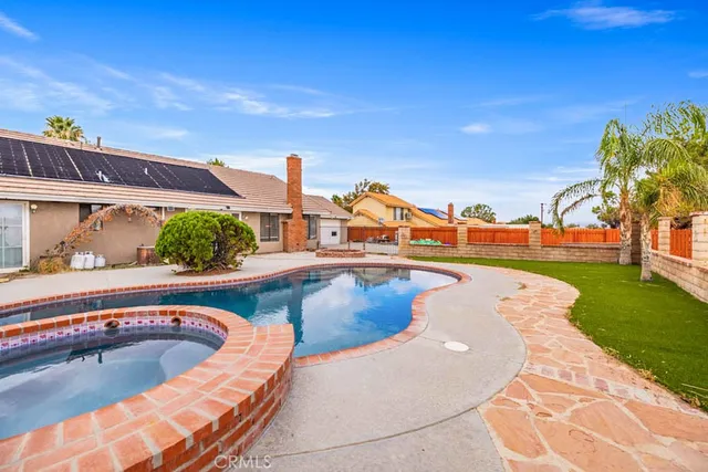 a view of a swimming pool with a lounge chairs