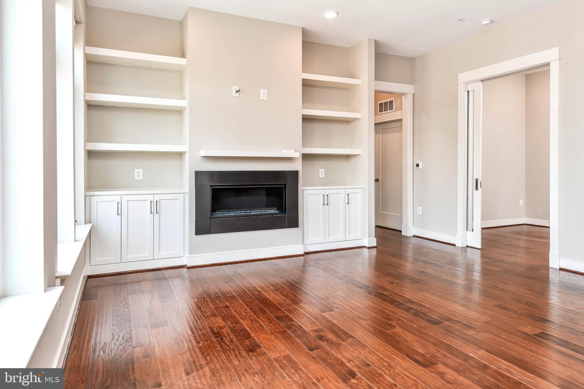 2 Stationmaster Street Southeast, Unit 302 Leesburg, VA 20175 - Photo 18 of 57 a view of a livingroom with wooden floor