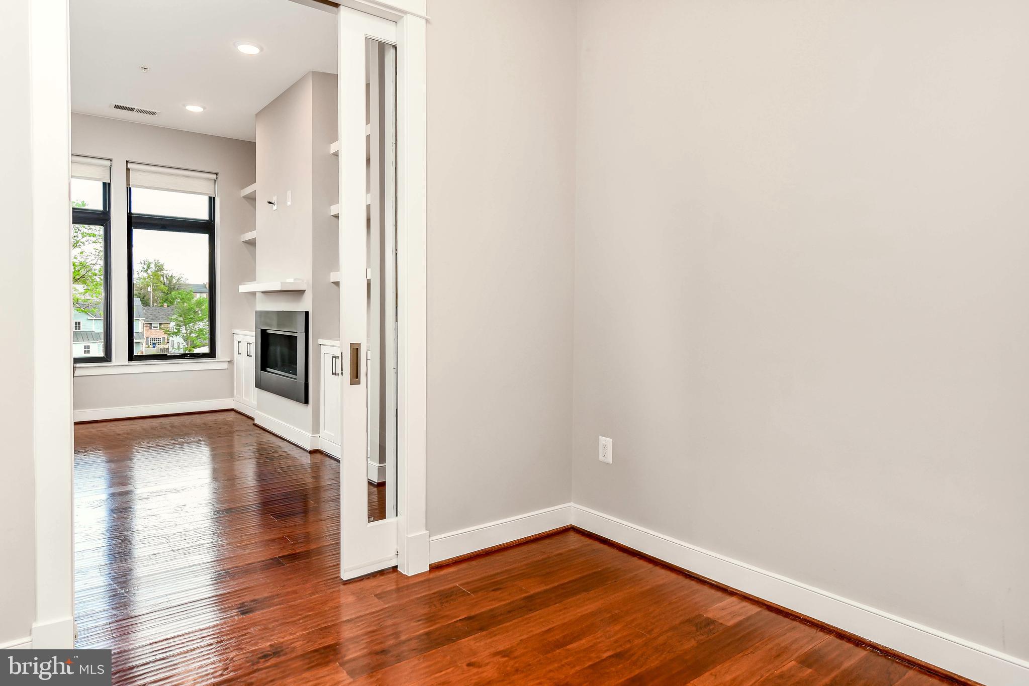 2 Stationmaster Street Southeast, Unit 302 Leesburg, VA 20175 - Photo 24 of 57 a view of a big room with wooden floor and windows