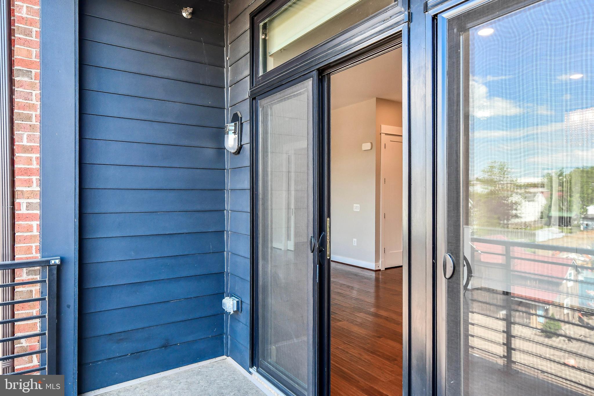 2 Stationmaster Street Southeast, Unit 302 Leesburg, VA 20175 - Photo 37 of 57 Balcony Sliding Door