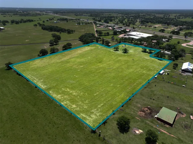 an aerial view of a golf course with chairs
