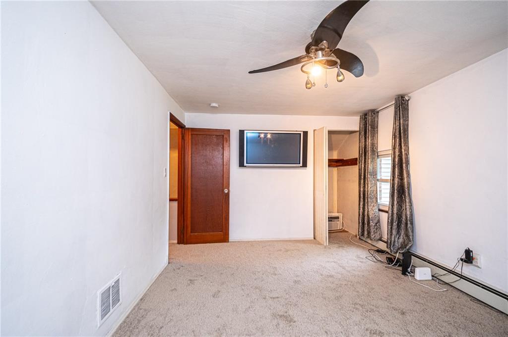 808 Jefferson Road Pittsburgh, PA 15235 - Photo 13 of 25 Second bedroom is a good size with ceiling fan and TV mount