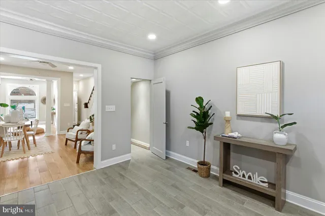 a view of a hallway with wooden floor