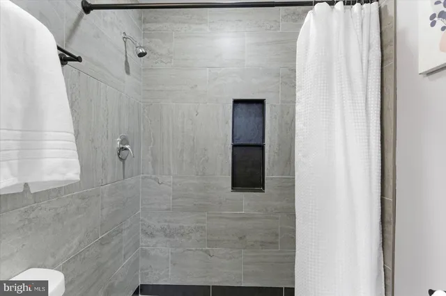 a front view of a house with a lots of windows