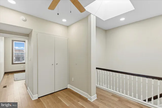 a view of a big house with a big yard and large trees