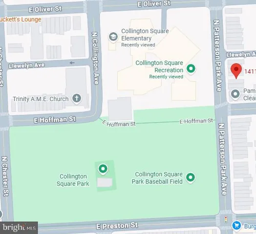 a view of a hallway with wooden floor and entryway