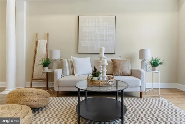 a view of a dining room with furniture and a chandelier