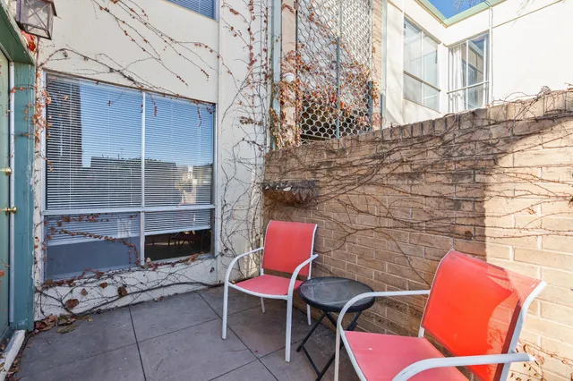 a outdoor space with a couch and chairs