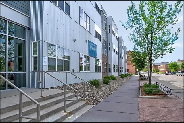 a view of a building with a yard