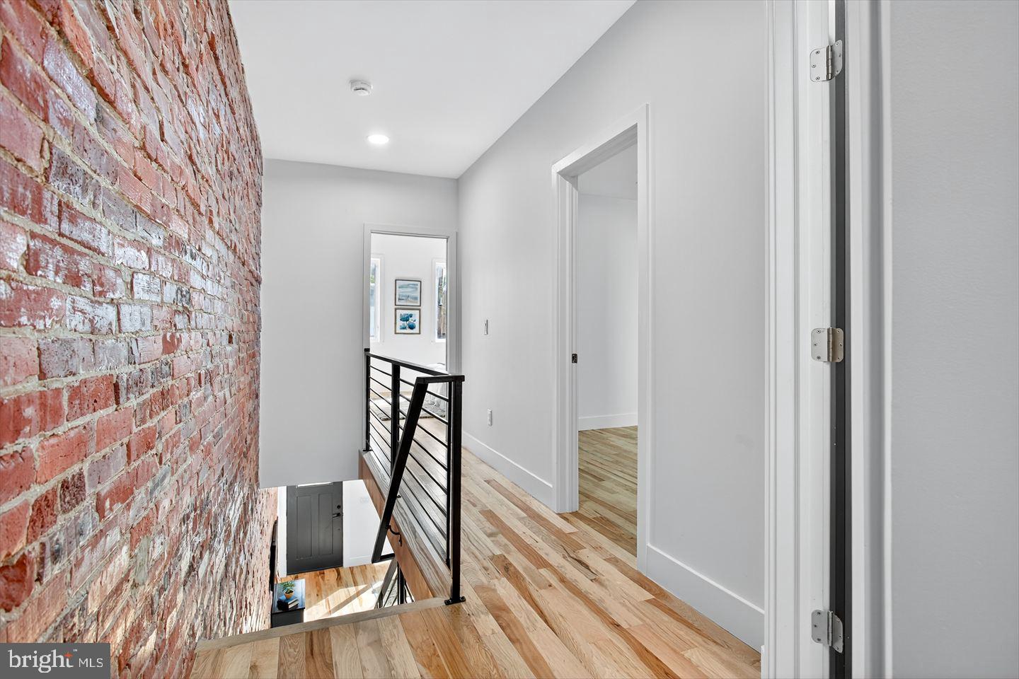1222 South 26th Street Philadelphia, PA 19146 - Photo 11 of 31 a view of a hallway with wooden floor and staircase