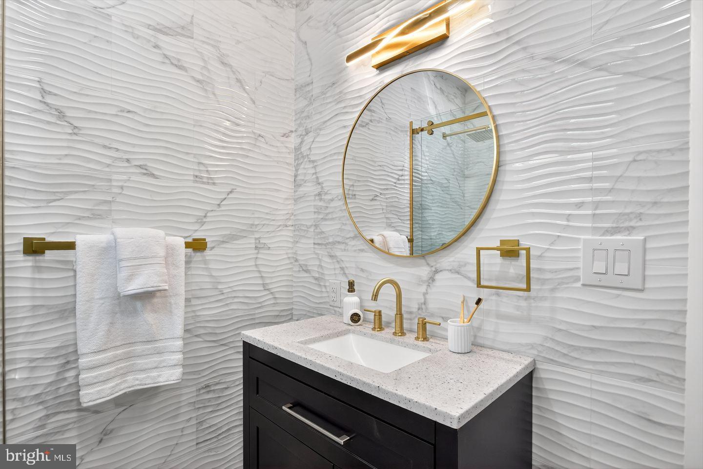 1222 South 26th Street Philadelphia, PA 19146 - Photo 16 of 31 a bathroom with a sink and a mirror