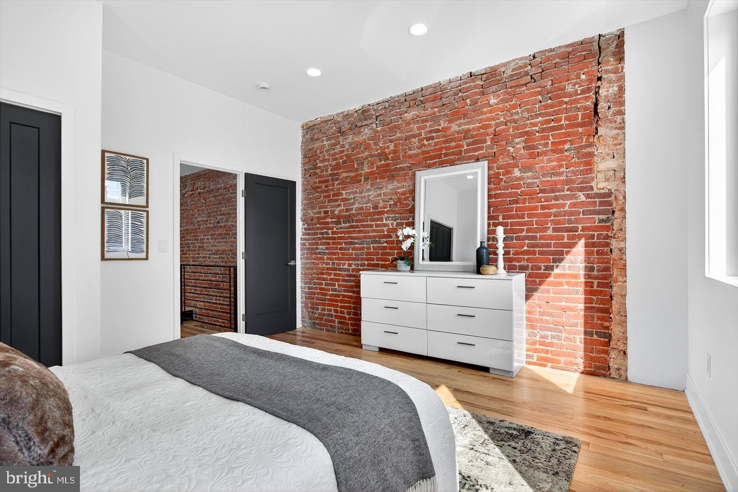 1222 South 26th Street Philadelphia, PA 19146 - Photo 21 of 31 a bedroom with a bed and cabinets