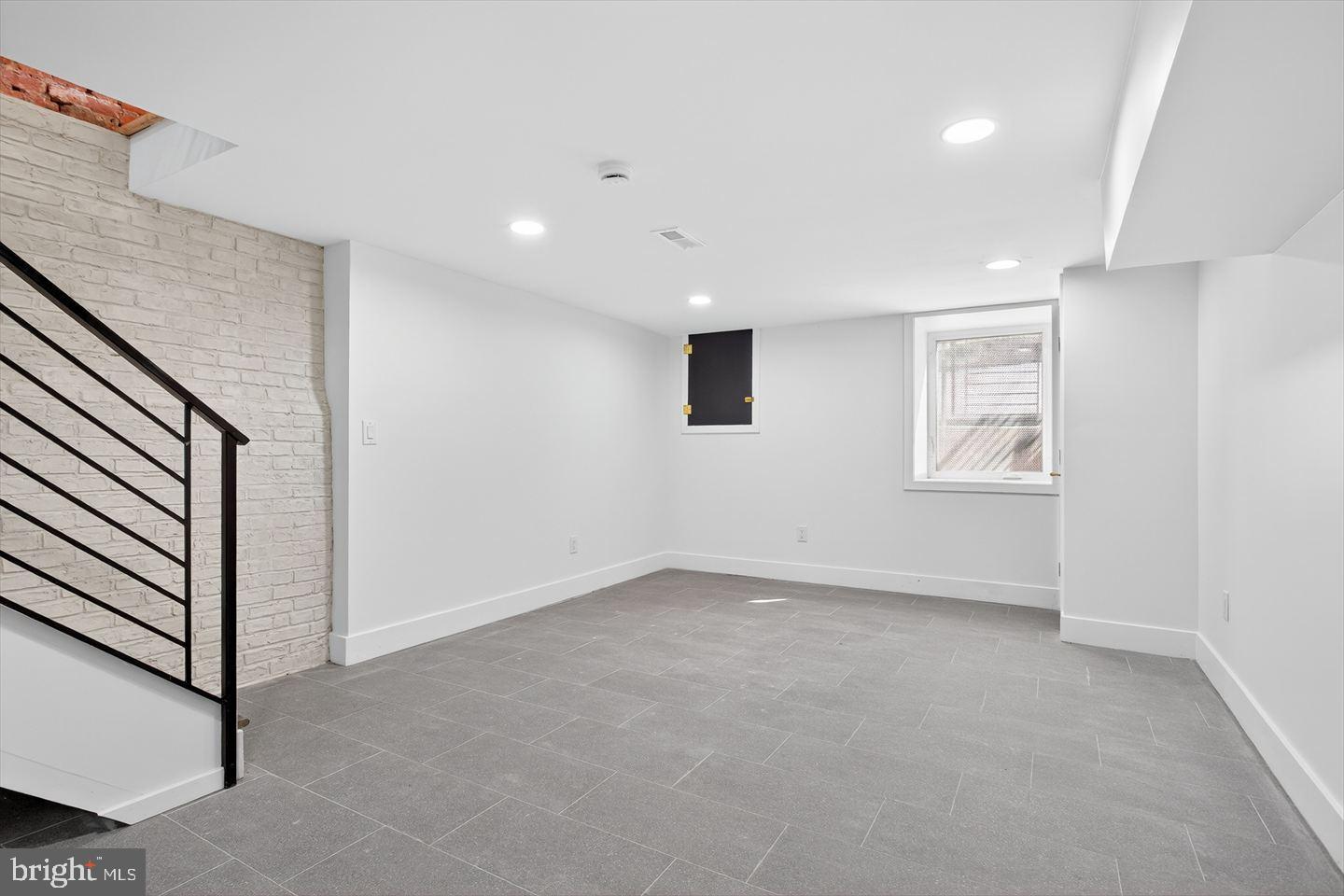 1222 South 26th Street Philadelphia, PA 19146 - Photo 23 of 31 a view of an empty room with a window