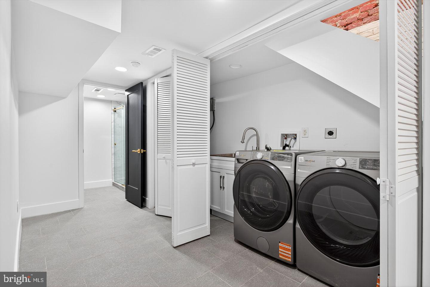 1222 South 26th Street Philadelphia, PA 19146 - Photo 24 of 31 a view of a hallway with washer and dryer