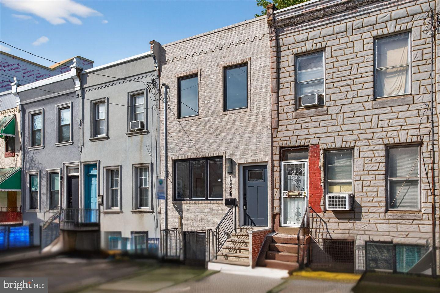 1222 South 26th Street Philadelphia, PA 19146 - Photo 30 of 31 a front view of a house with glass windows and yard