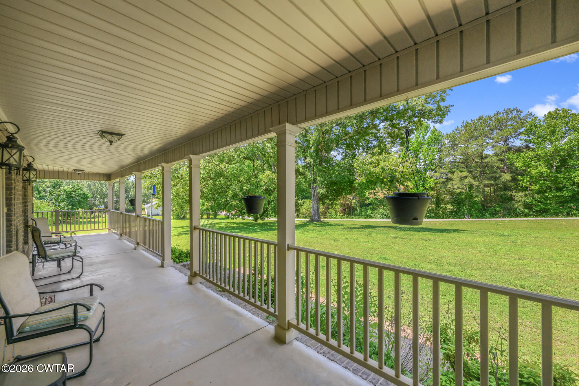 492 Joe Horton Road Lexington, TN 38351 - Photo 2 of 49 a view of a patio with couches plants and large trees