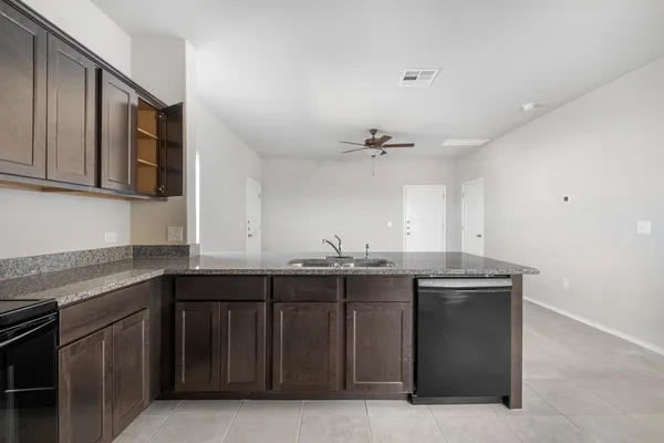 a kitchen with a sink and cabinets