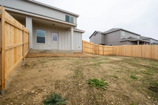 a view of a backyard of the house