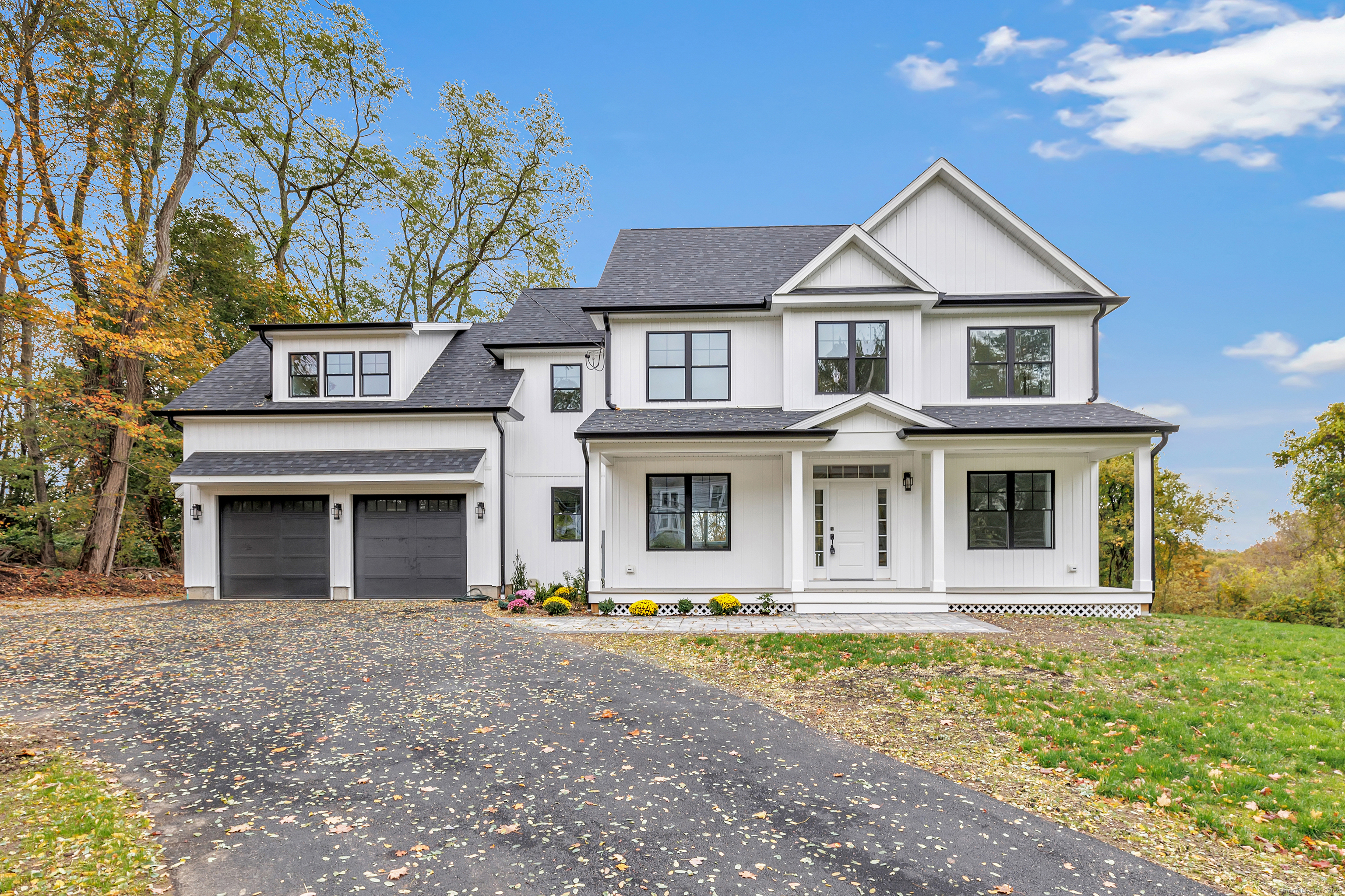 128 Barn Hill Road Monroe, CT 06468 - Photo 1 of 40 a front view of a house with garden