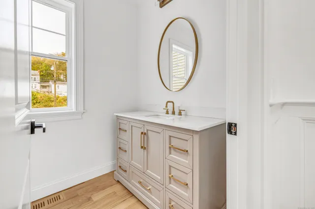 a bathroom with a sink and a mirror