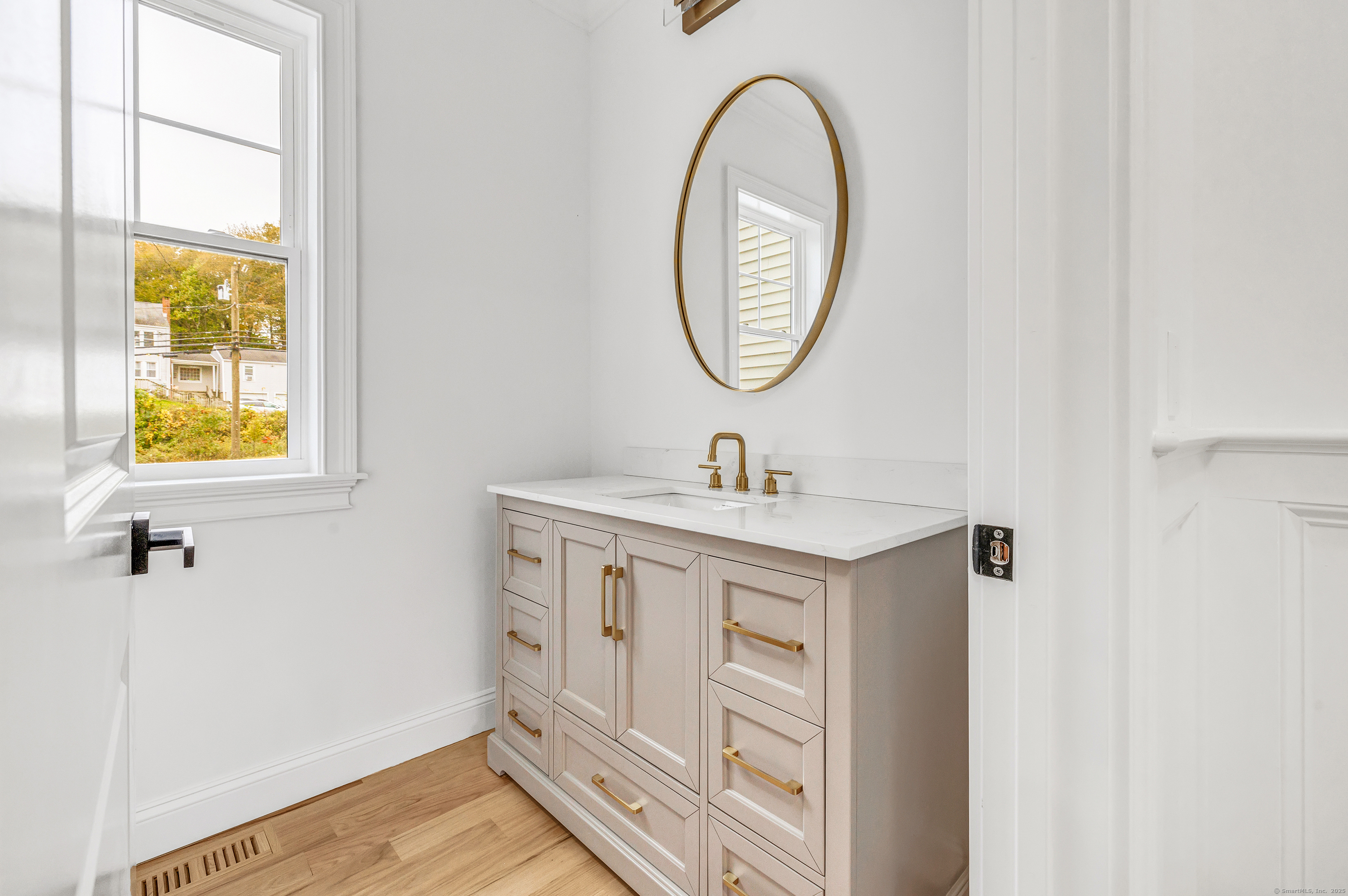 128 Barn Hill Road Monroe, CT 06468 - Photo 17 of 40 a bathroom with a sink and a mirror
