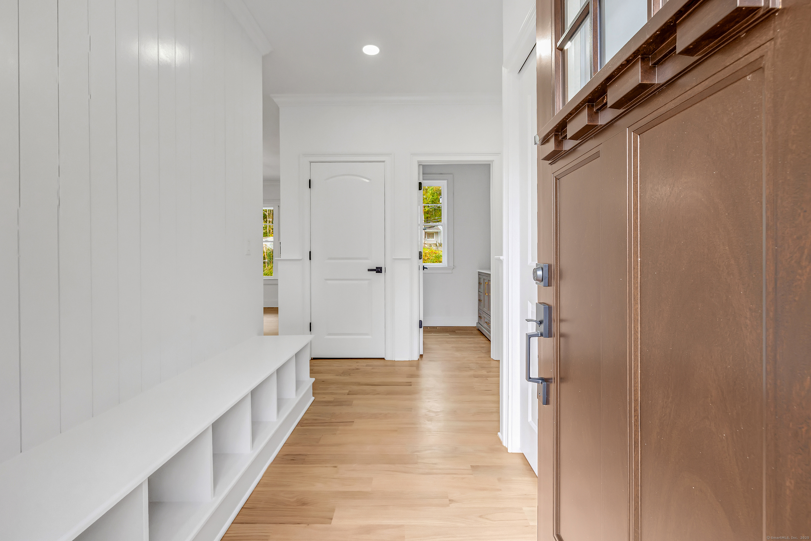 128 Barn Hill Road Monroe, CT 06468 - Photo 19 of 40 a view of a hallway with wooden floor and staircase