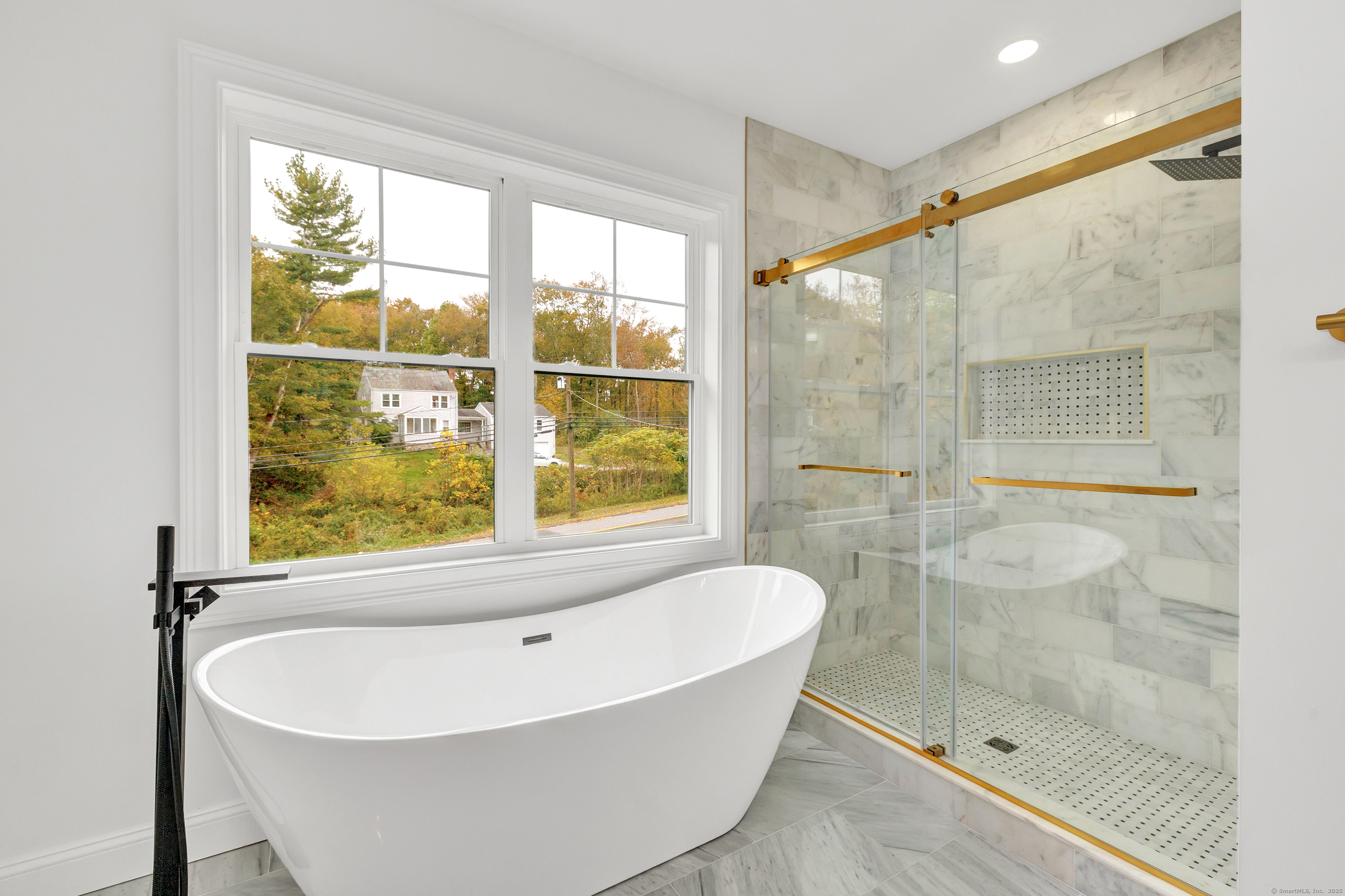 128 Barn Hill Road Monroe, CT 06468 - Photo 24 of 40 a white bath tub sitting next to a shower