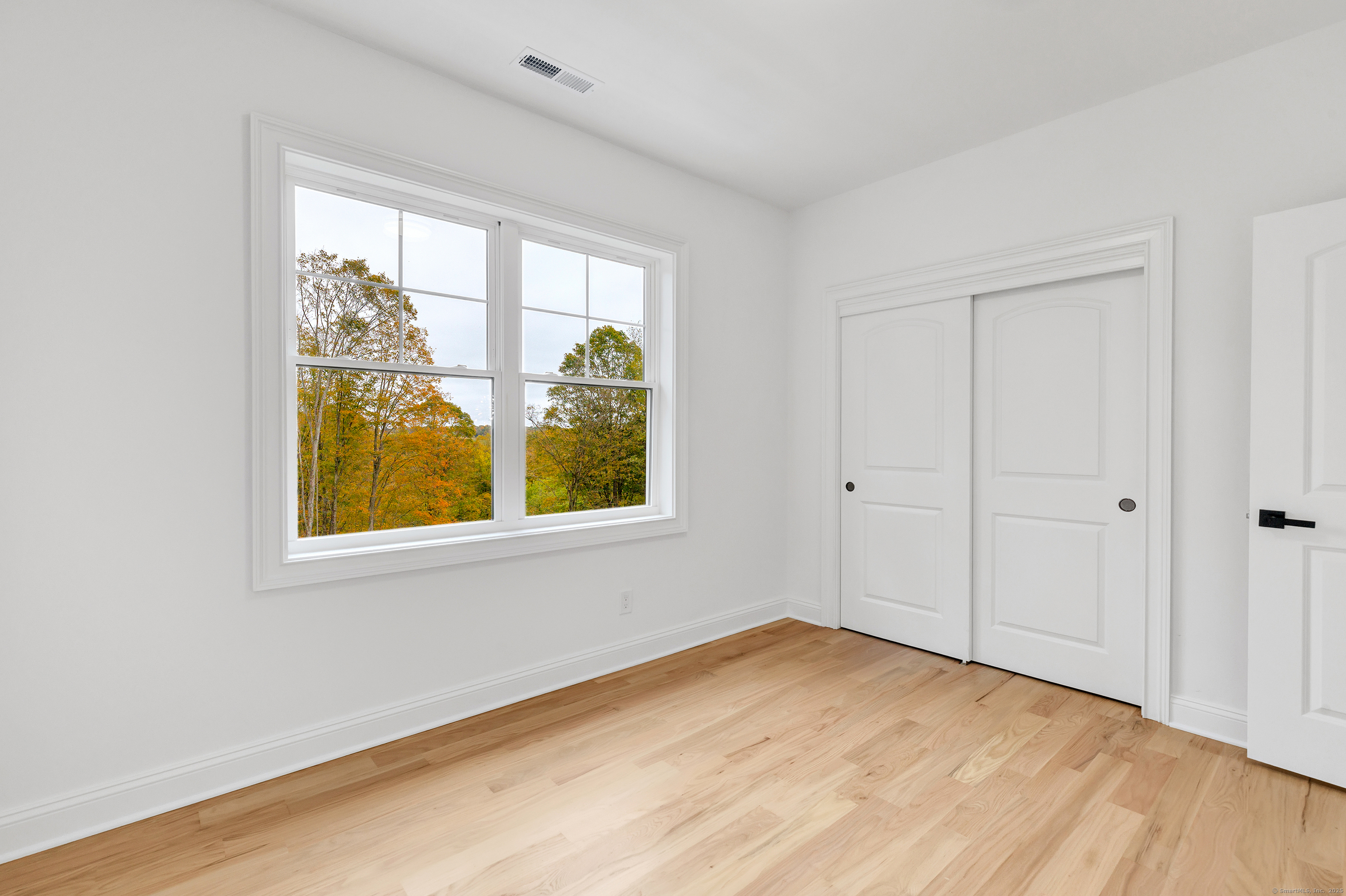 128 Barn Hill Road Monroe, CT 06468 - Photo 28 of 40 a view of an empty room with a window