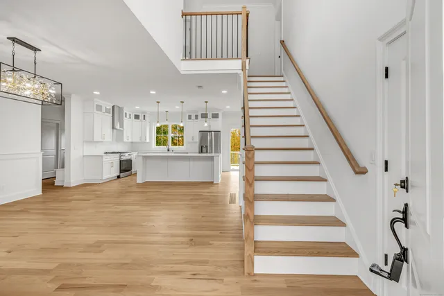 a view of a kitchen with furniture and staircase