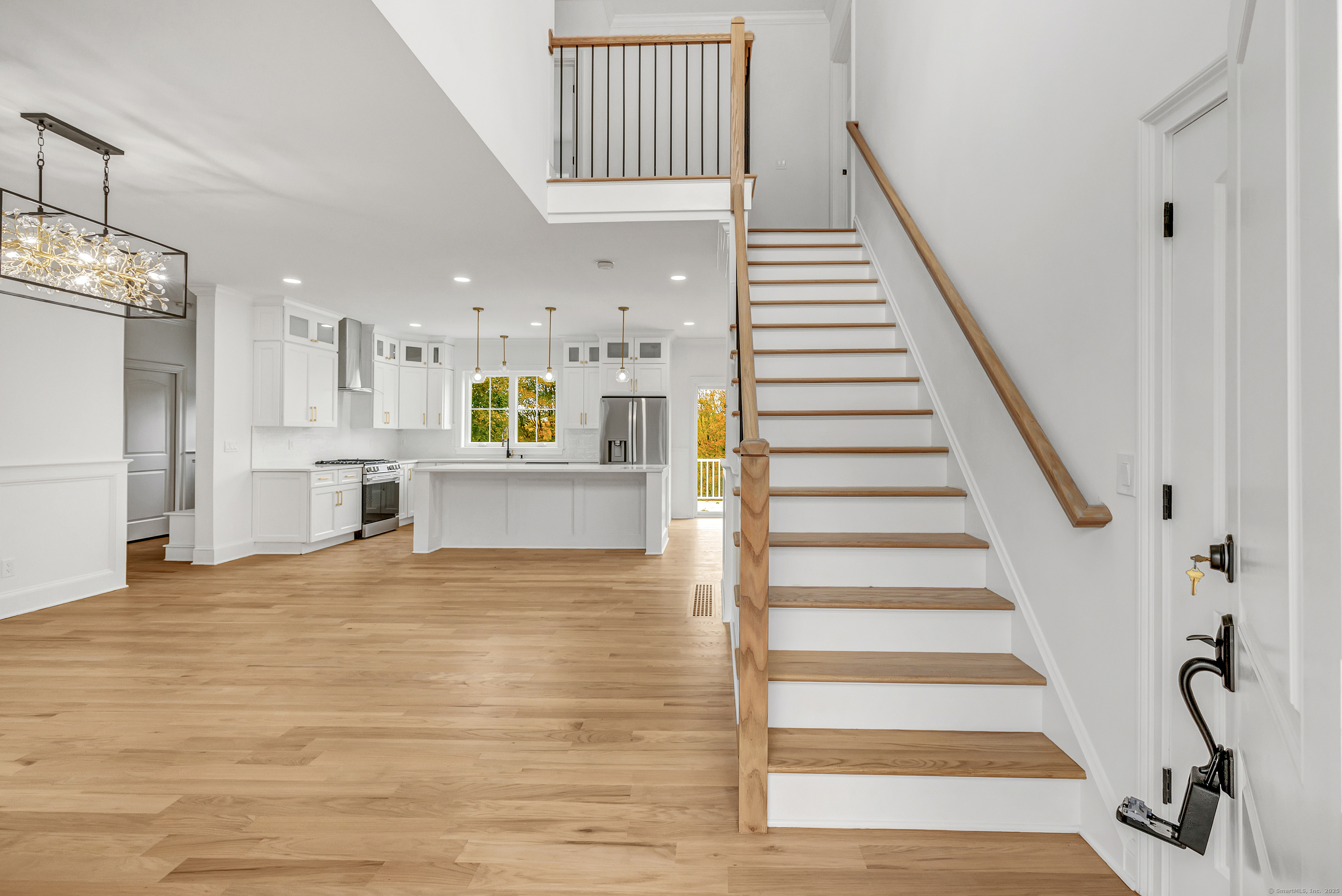 128 Barn Hill Road Monroe, CT 06468 - Photo 3 of 40 a view of a kitchen with furniture and staircase