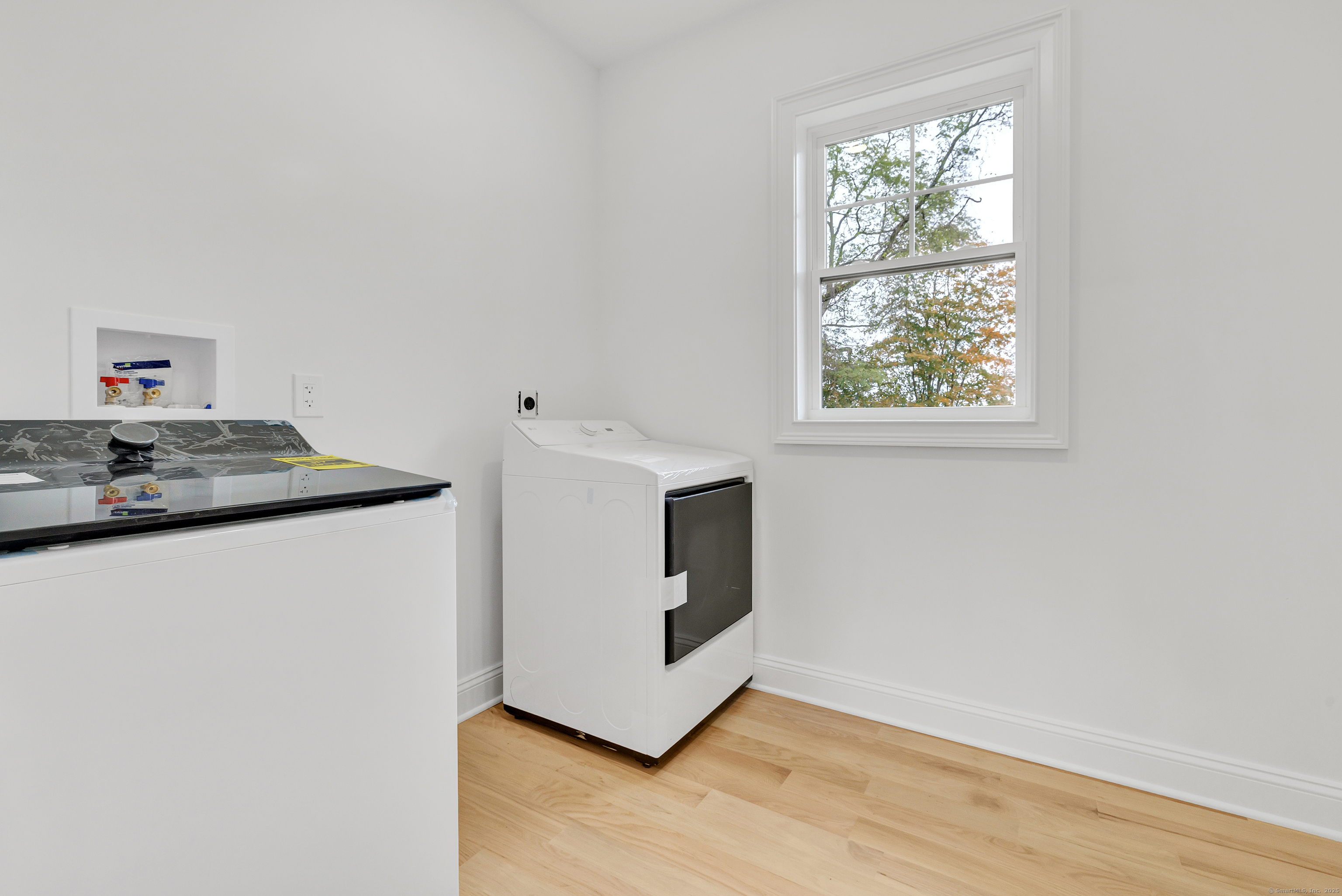 128 Barn Hill Road Monroe, CT 06468 - Photo 31 of 40 a view of kitchen cabinets and wooden floor